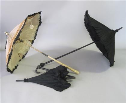 Appraisal: Three Victorian silk ivory and ebonized ladies' umbrellas mid to