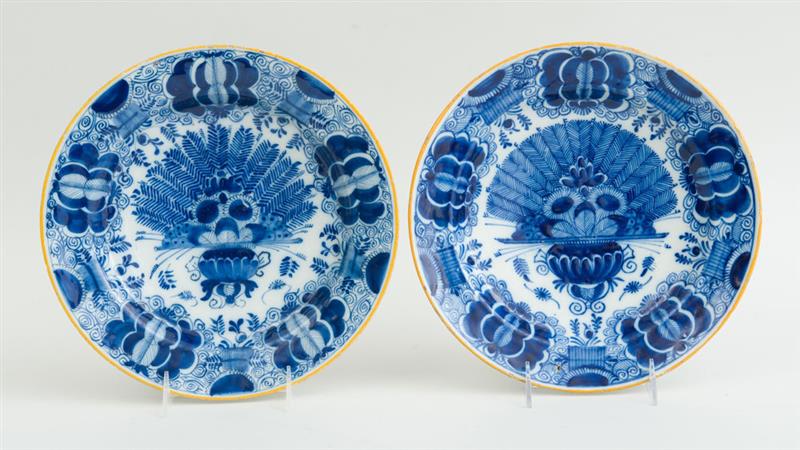 Appraisal: TWO SIMILAR DUTCH BLUE AND WHITE DELFT PEACOCK PLATES Each