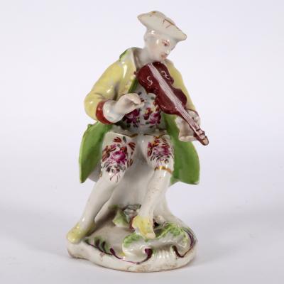 Appraisal: A Derby dry-edge figure of a violinist circa wearing a