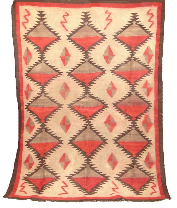 Appraisal: Rug features bold graphic geometric pattern in red brown and