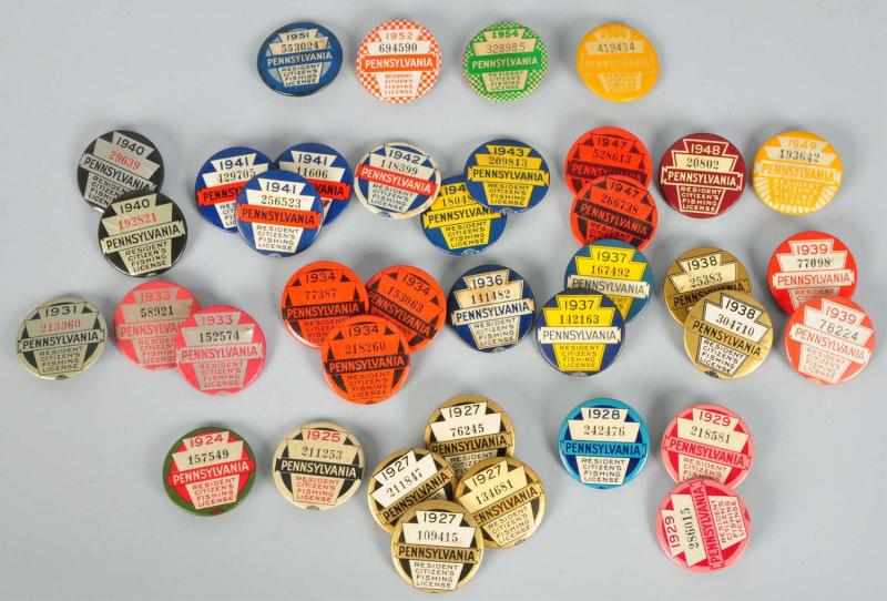 Appraisal: Lot of Pennsylvania Fishing License Pins Description Celluloid pin back