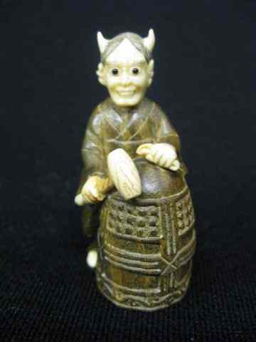 Appraisal: Carved Ivory Boxwood Netsuke of devil with mallet ''