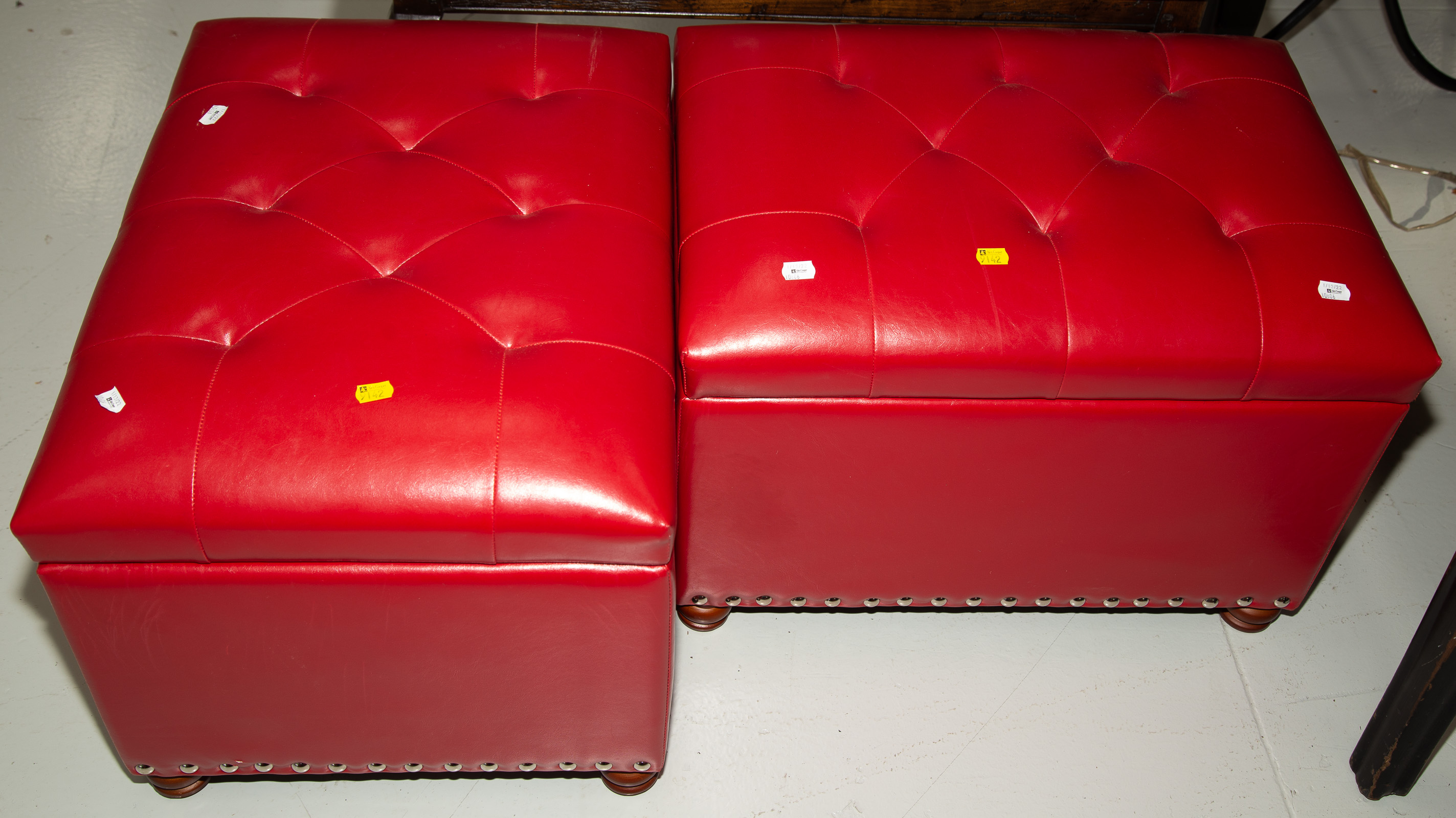 Appraisal: A PAIR OF STORAGE HASSOCKS Modern with simulated red leather