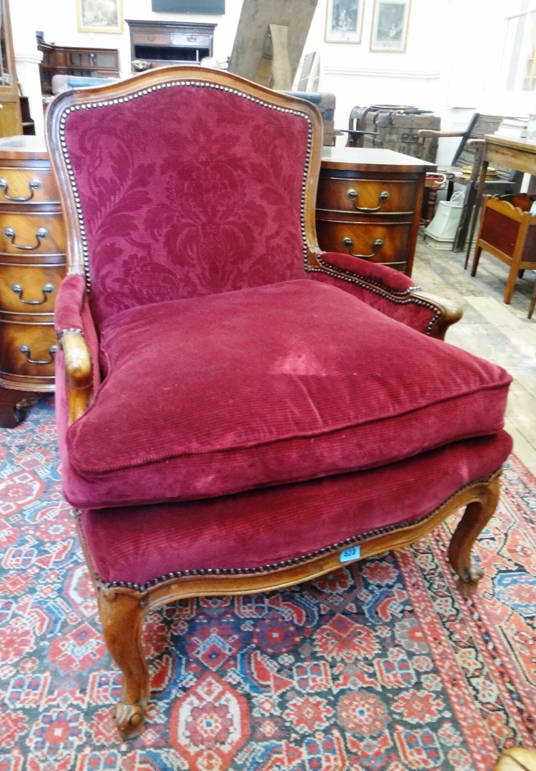 Appraisal: A pair of Louis XV style walnut frame fauteuils stamped