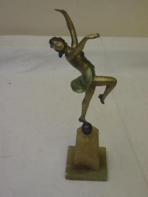 Appraisal: AN ART DECO SPELTER FIGURE modelled as a female dancer