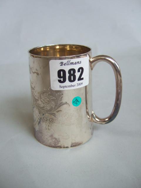 Appraisal: A Victorian silver christening mug with floral and scroll engraved