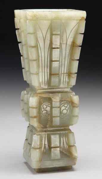 Appraisal: Chinese late Ming carved jade Gu vase depictingthe face of