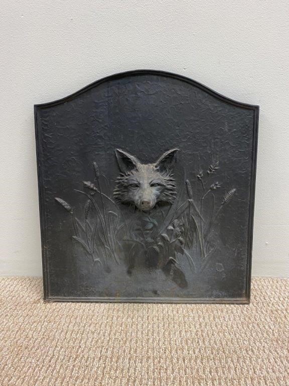 Appraisal: Reproduction cast iron fireback with fox head mask h x