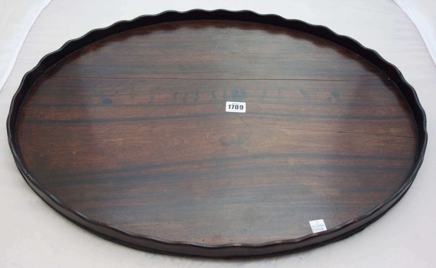 Appraisal: An th century mahogany oval tray with wavy gallery cm