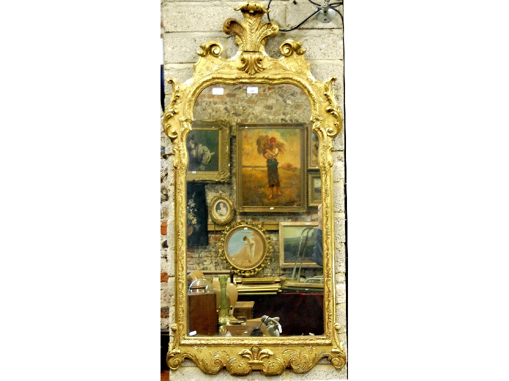 Appraisal: A th century giltwood framed mirror in the Rococo style