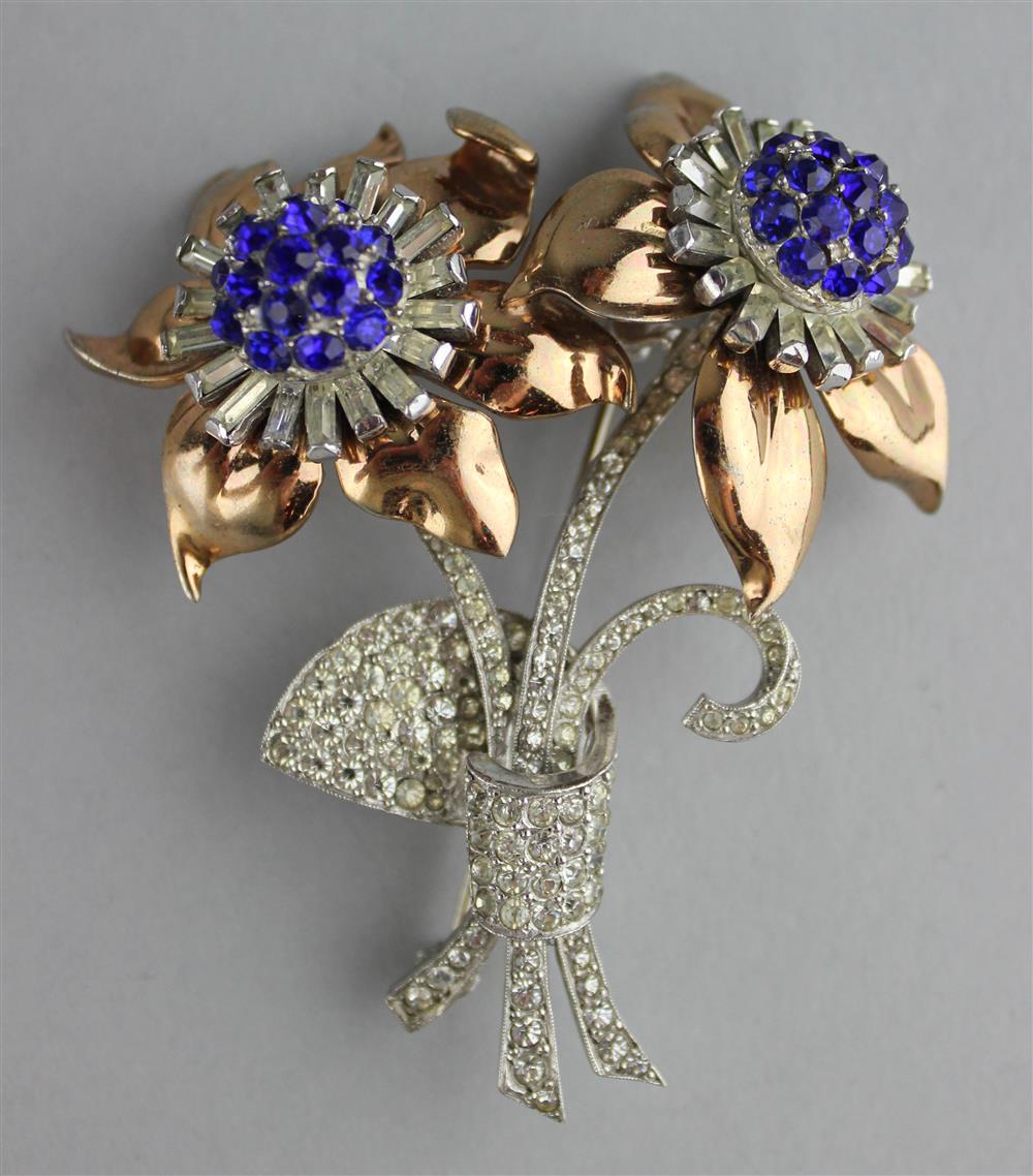 Appraisal: PENNINO STERLING FLOWER PIN WITH BLUE AND COLORLESS RHINESTONES signed