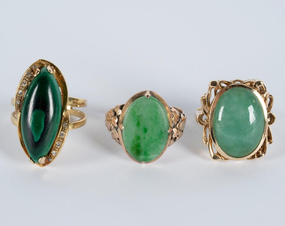 Appraisal: THREE ASSORTED YELLOW GOLD GREEN-STONE DIAMOND RINGSone karat rose gold