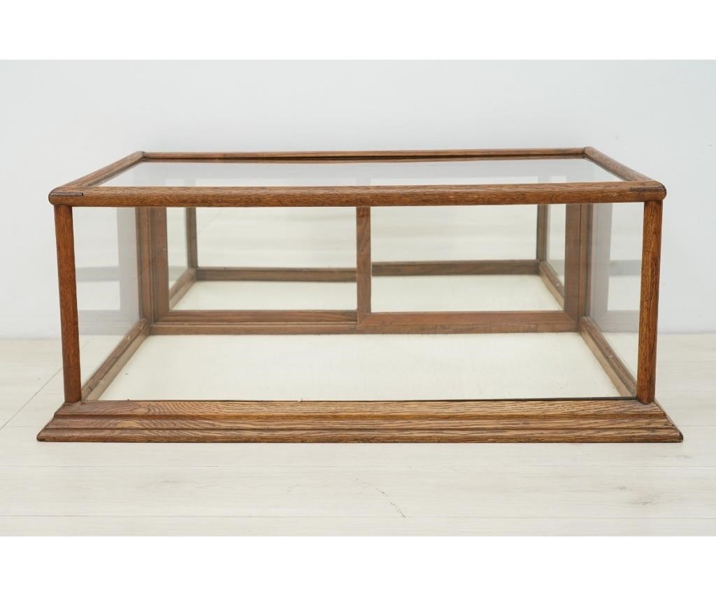 Appraisal: Oak counter top display case with glass and mirrored back