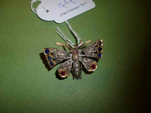 Appraisal: A RUBY SAPPHIRE AND DIAMOND SET BUTTERFLY BROOCH with a