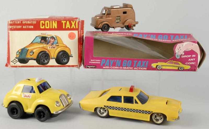 Appraisal: Lot of Battery-Operated Car Banks Description Includes two Taxi banks