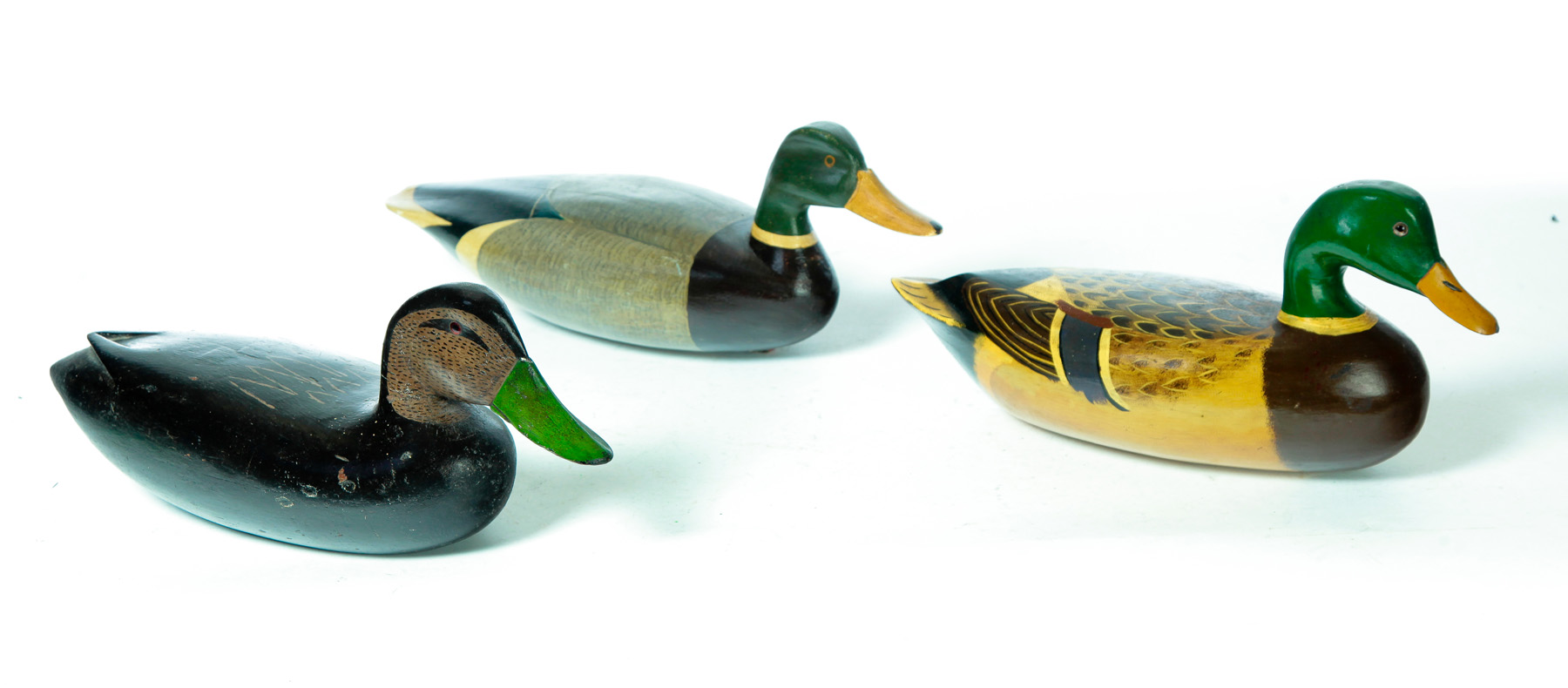 Appraisal: THREE AMERICAN DUCK DECOYS Mid th century Original paint Black