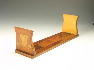 Appraisal: An Irish Kilarney yew and marquetry folding book rack decorated