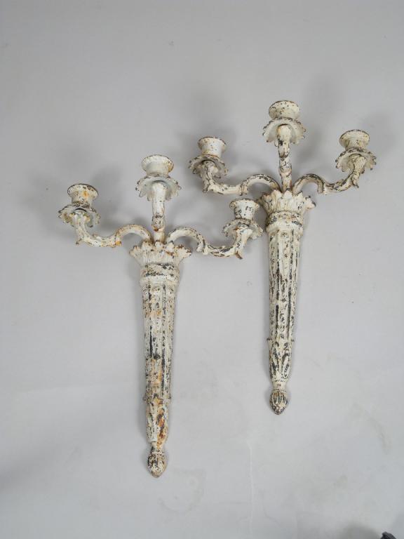 Appraisal: Pair of cast iron three branch Wall Lights with leafage