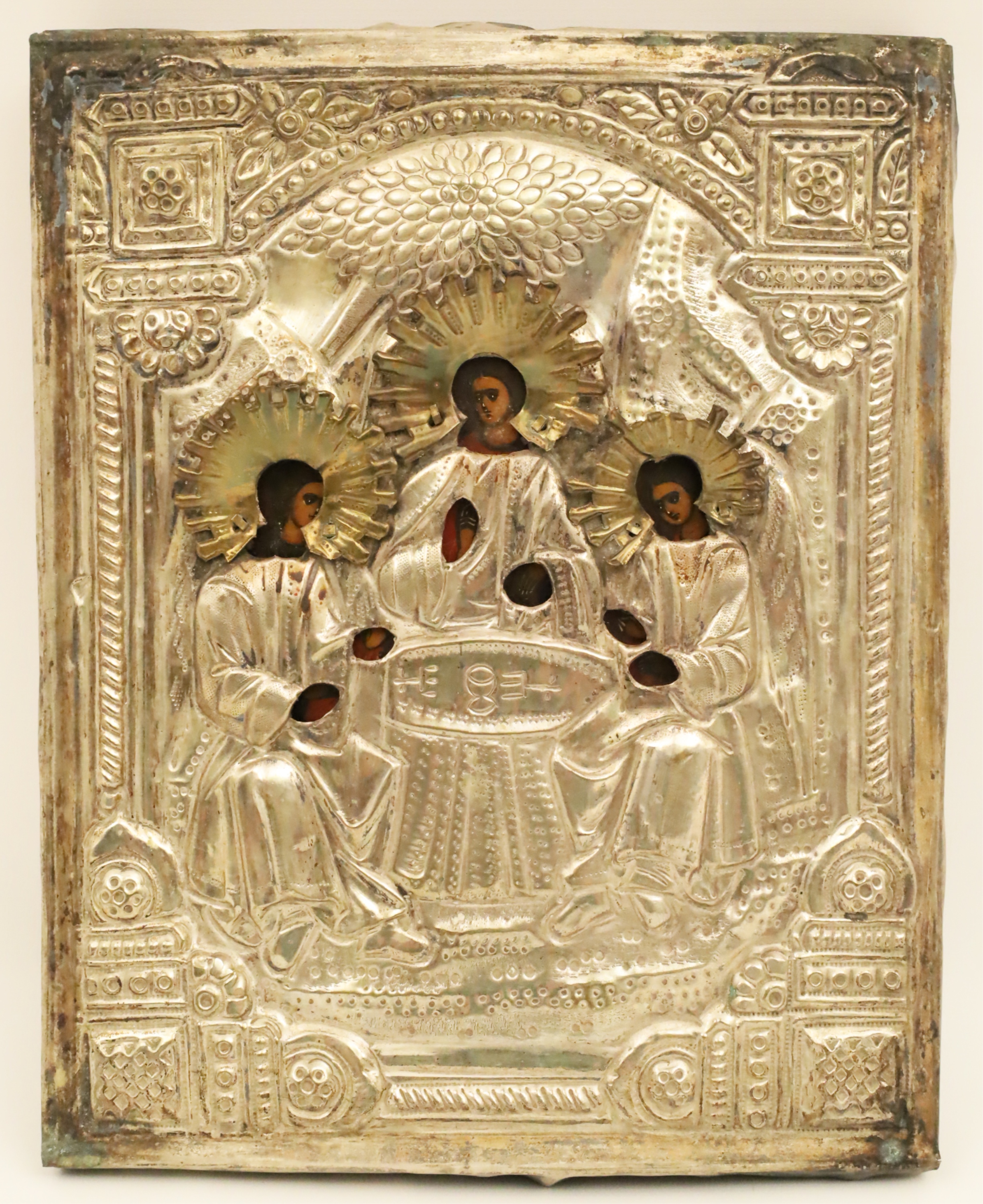 Appraisal: RUSSIAN ICON OLD TESTAMENT TRINITY A silvered riza icon heavily