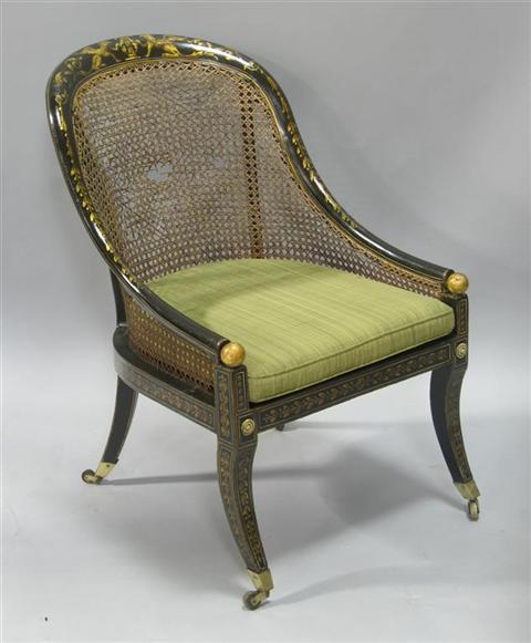 Appraisal: REGENCY STYLE EBONIZED GILT CANED TUB CHAIR The bowed crestrail