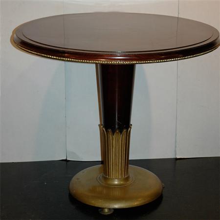 Appraisal: Art Deco Parcel Gilt Mahogany and Brass Center Table Estimate