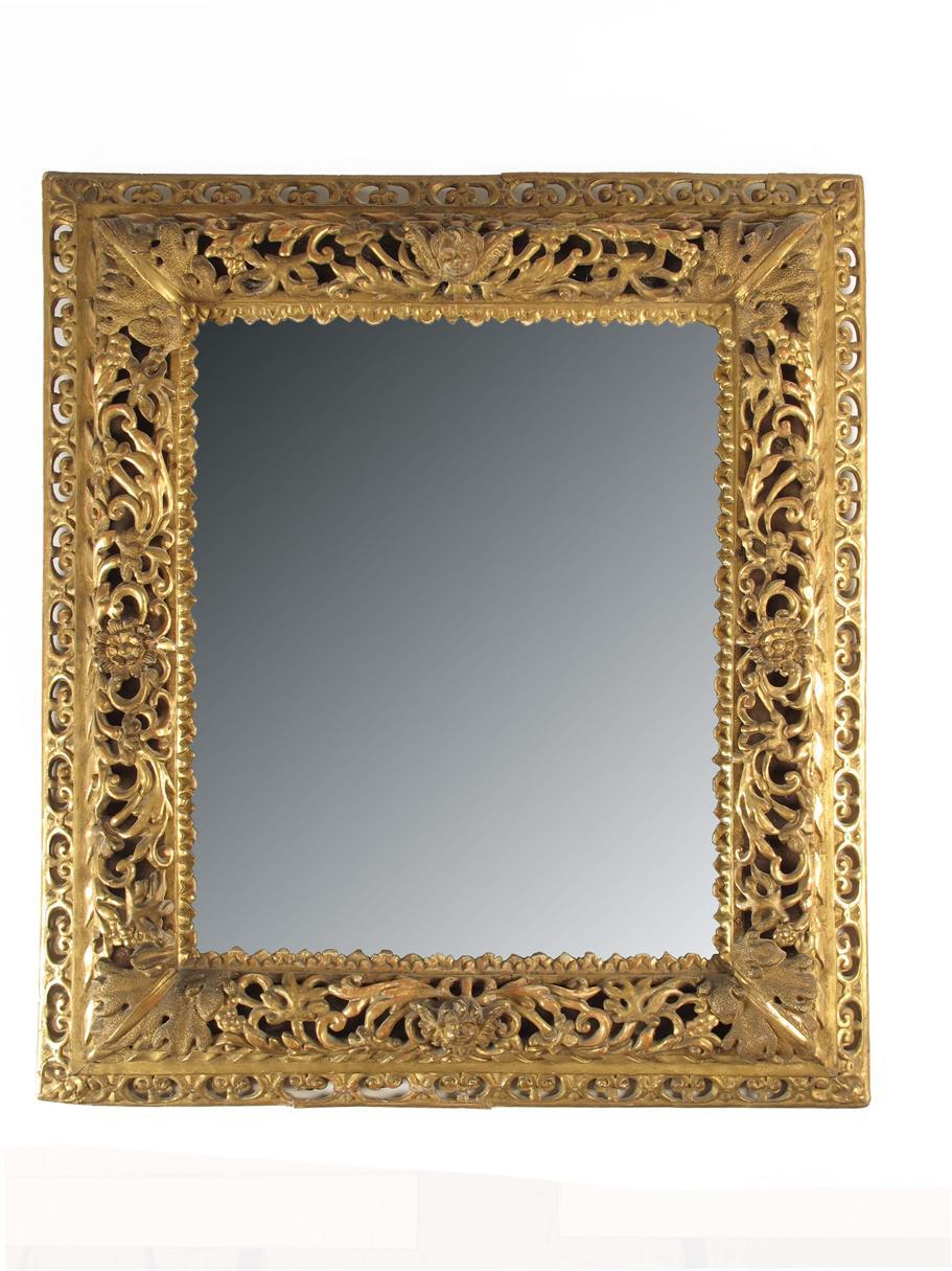 Appraisal: An Italian giltwood and gesso rectangular wall mirror