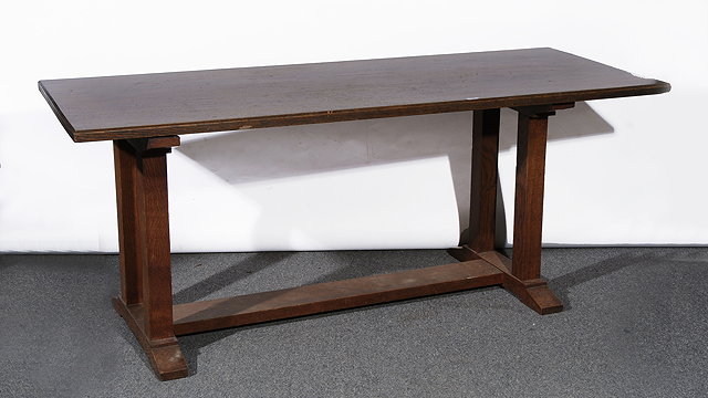 Appraisal: AN OAK REFECTORY TABLE in the manner of Heals with