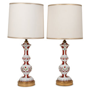 Appraisal: A Pair of Bohemian Enameled White Overlay Ruby Glass Lamps