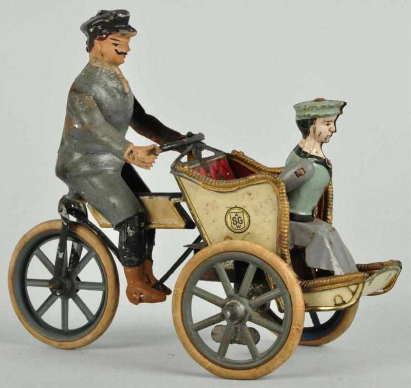 Appraisal: Tin Guntherman Motorcycle Wind-Up Toy Description German Working Handpainted driver