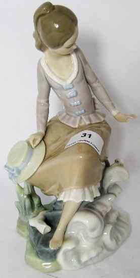 Appraisal: Lladro Figure of Lady sat on Rocks ''At the Seaside''