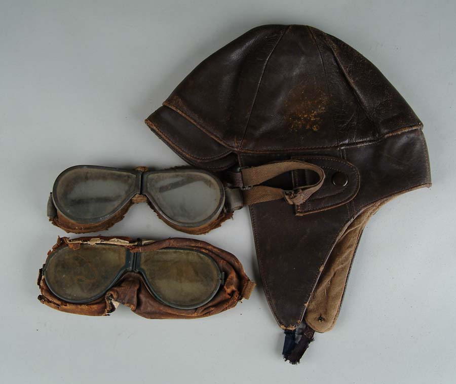 Appraisal: BROWN LEATHER FRENCH-MADE FLYING HELMET AND TWO PAIR OF FLYING