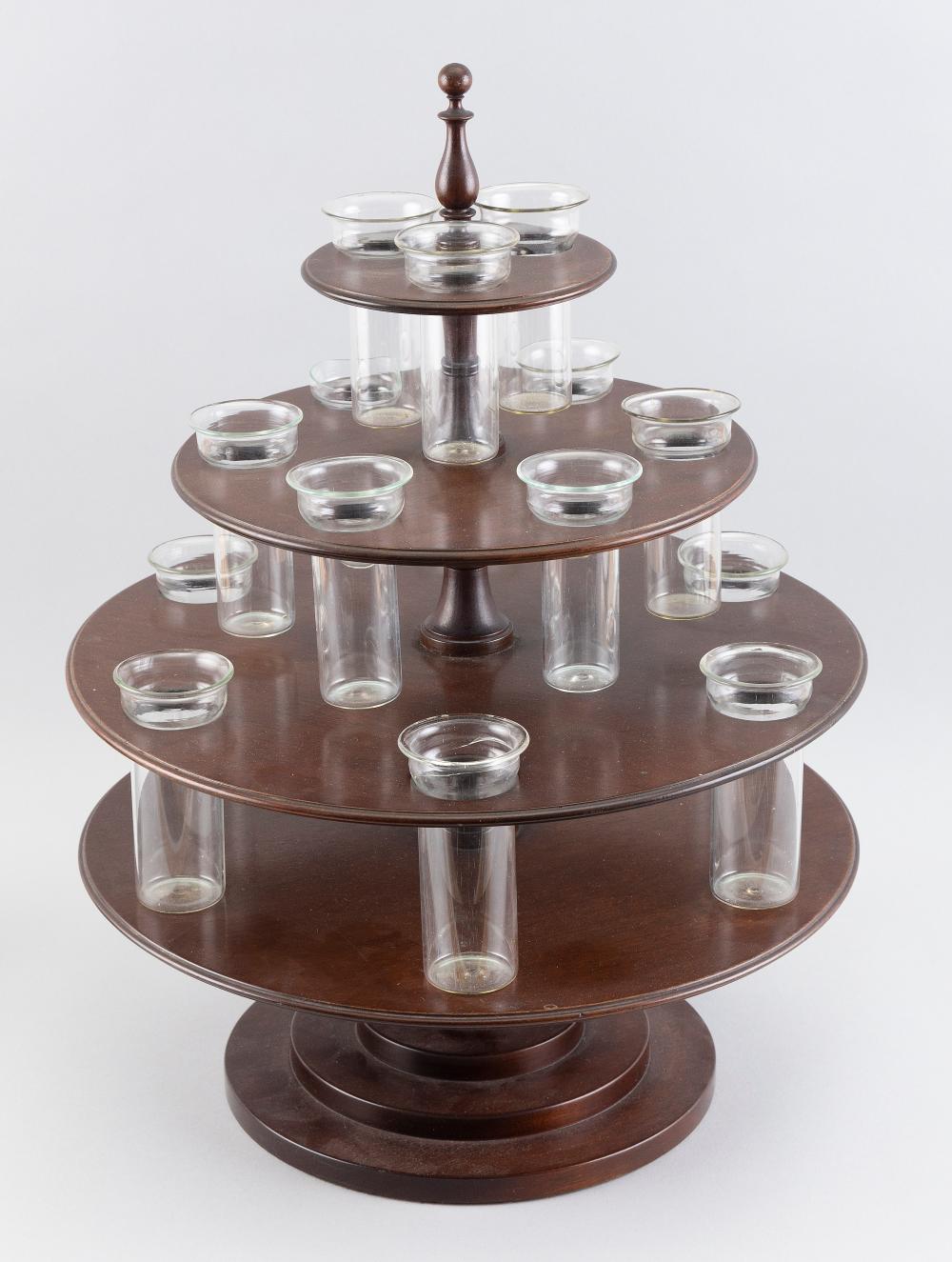 Appraisal: FOUR-TIER MAHOGANY CENTERPIECE EARLY TH CENTURY TOTAL HEIGHT DIAMETER FOUR-TIER