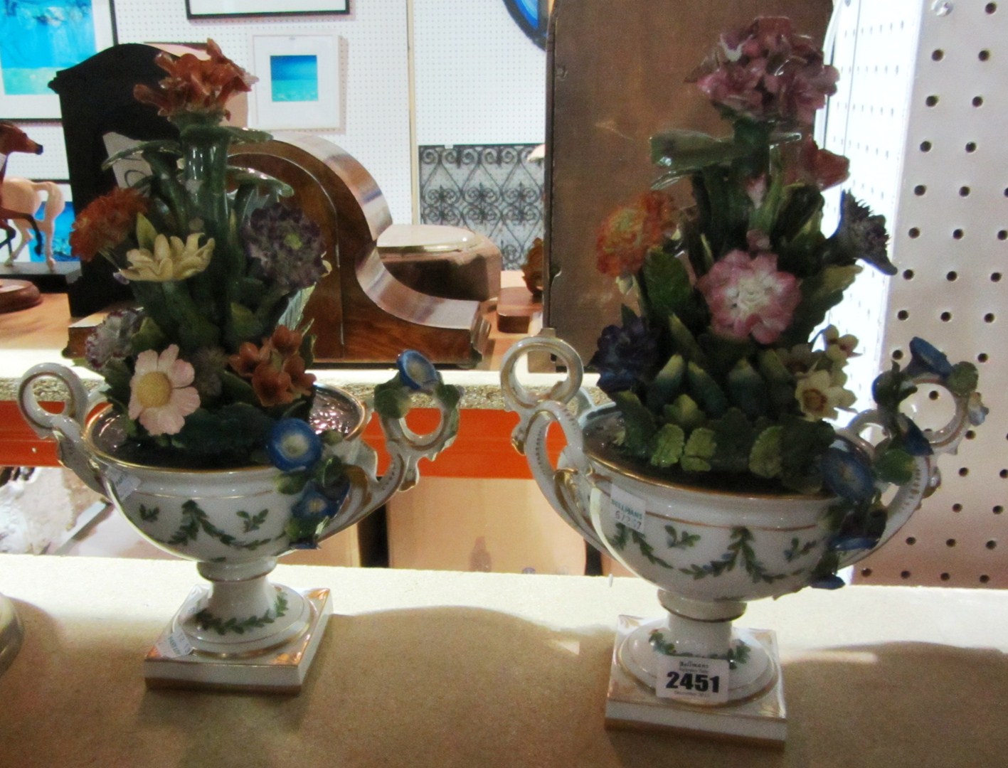 Appraisal: A pair of English porcelain shallow Campana vases of flowers