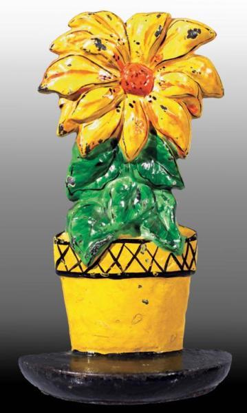 Appraisal: Cast Iron Yellow Poinsettia Doorstop Description Made by Hubley Rare