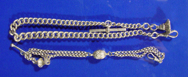 Appraisal: Two gentleman's silver pocket watch chains and a gilt metal