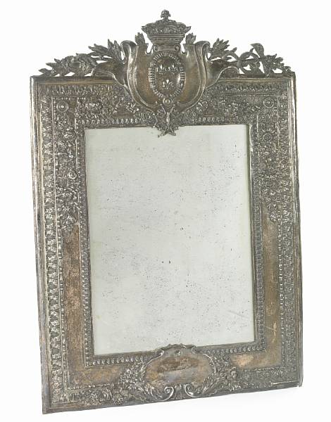 Appraisal: A plated wall mirror Vertical rectangular with armorial crest Height