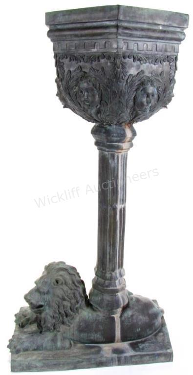 Appraisal: A large bronze patinated cast metal vertical planter with lion