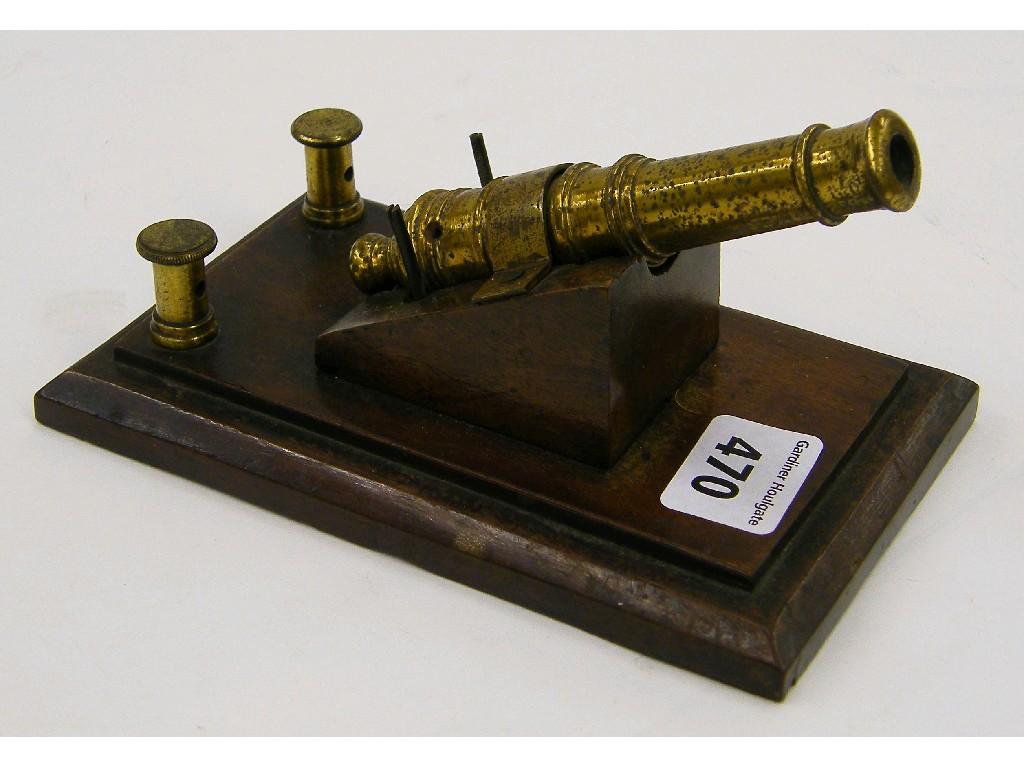 Appraisal: Interesting miniature brass cannon mounted on a mahogany base applied