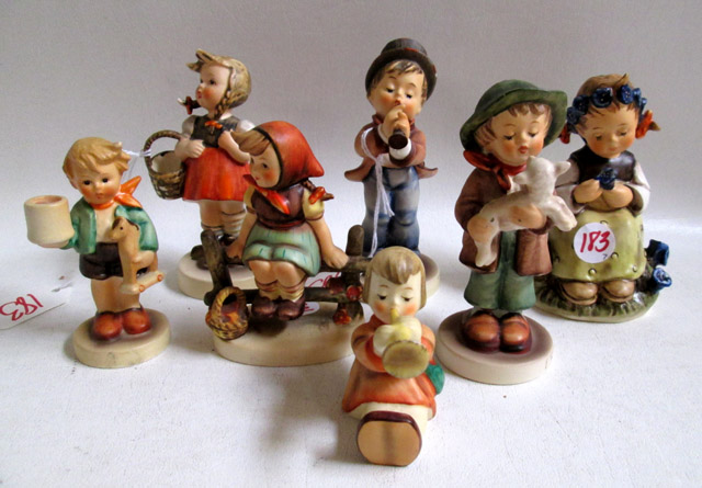 Appraisal: SEVEN HUMMEL FIGURINES soft paste porcelain Little Shopper HUM TM-