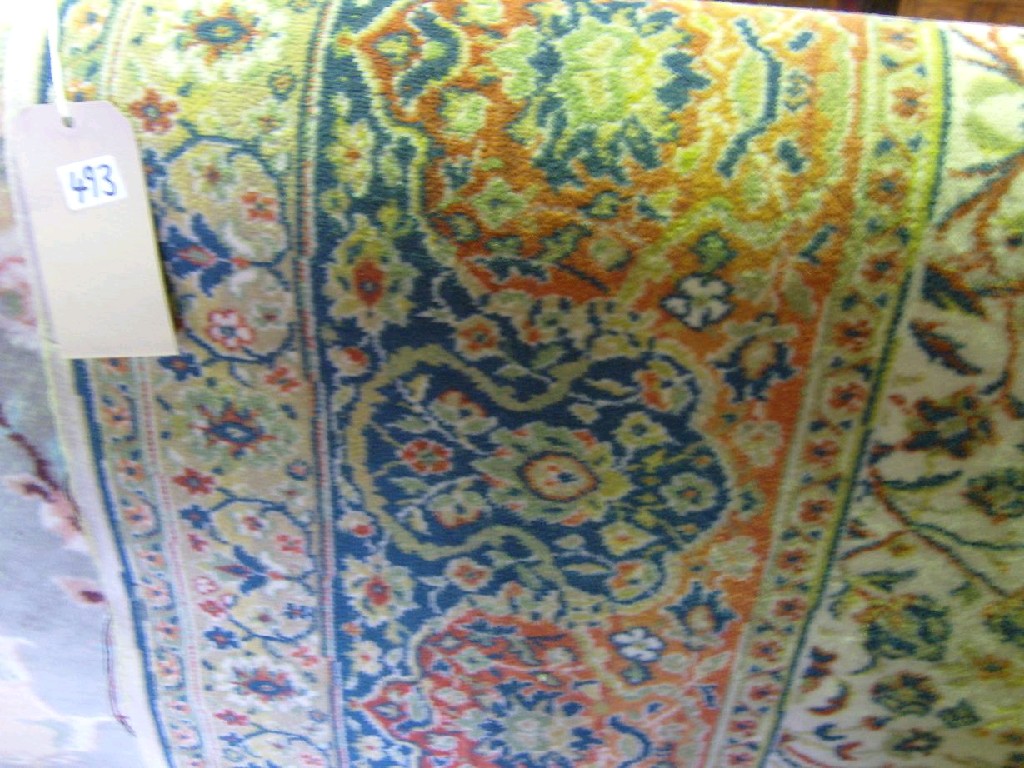 Appraisal: A Wilton wool carpet with Persian style repeating floral decoration