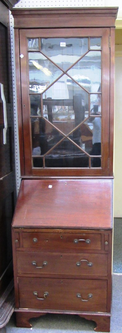 Appraisal: A small George III style mahogany bureau bookcase with three