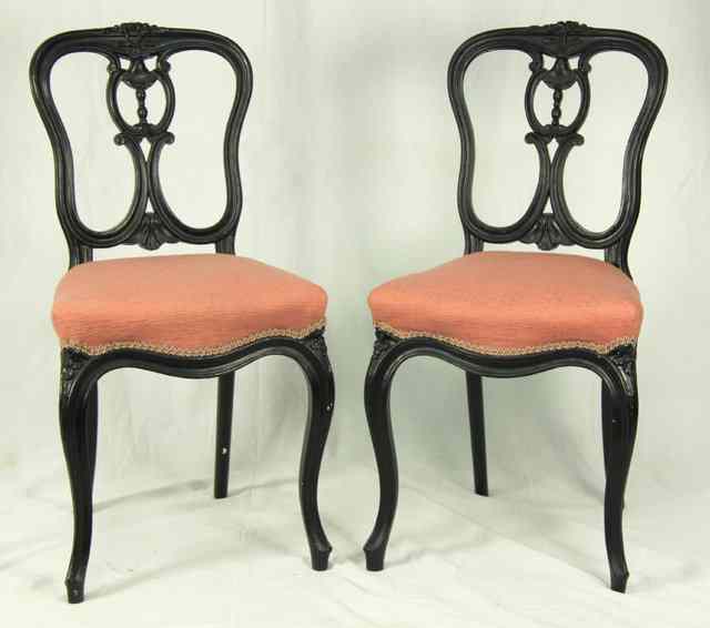 Appraisal: A pair of Louis XV style black painted dining chairs