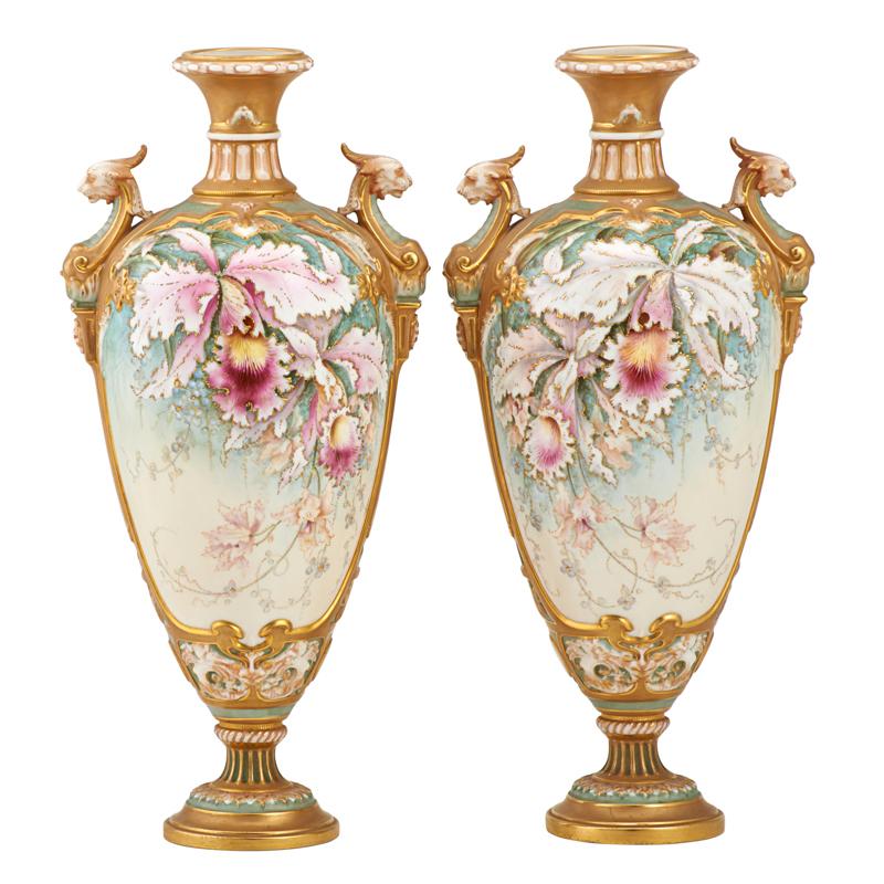 Appraisal: PAIR OF ROYAL WORCESTER PORCELAIN URNS Hand-painted floral design with