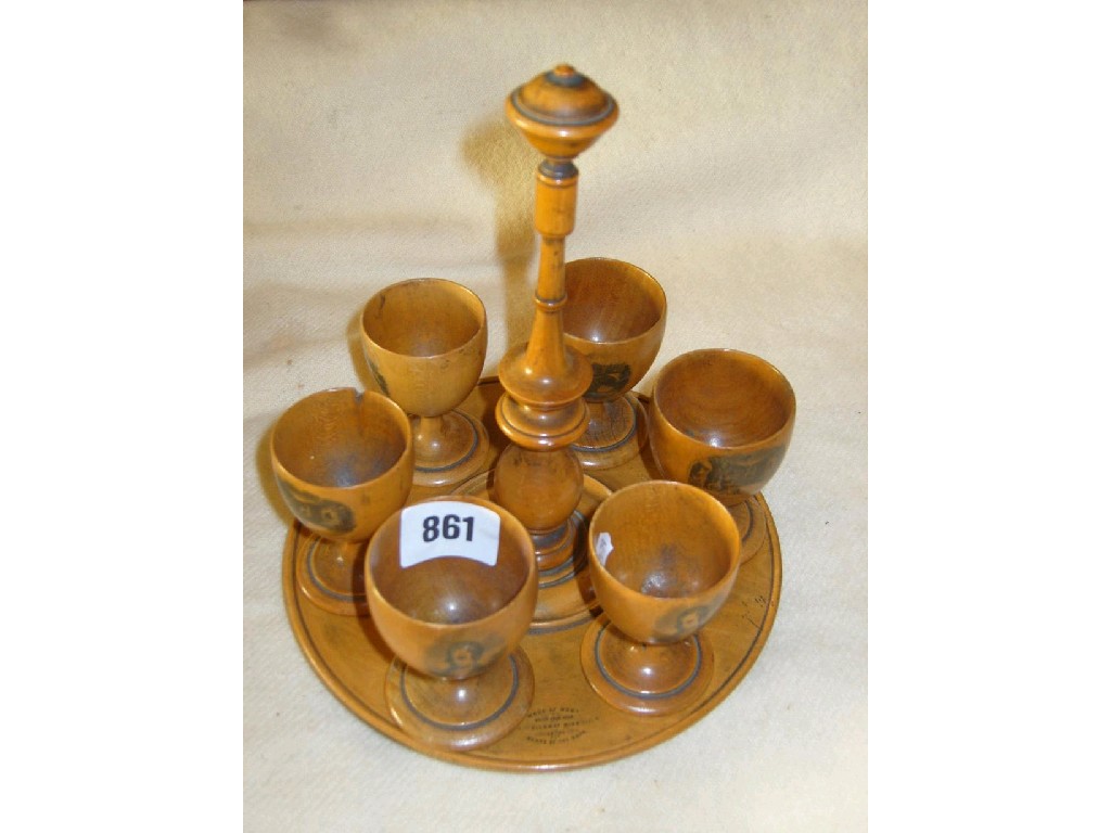 Appraisal: A Mauchline ware egg cup cruet the circular frame raised