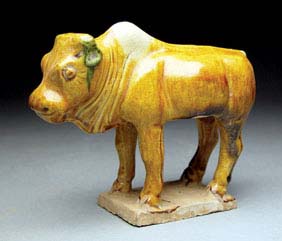 Appraisal: SMALL TANG SANCAI GLAZED BULL Charming and very realistically modeled