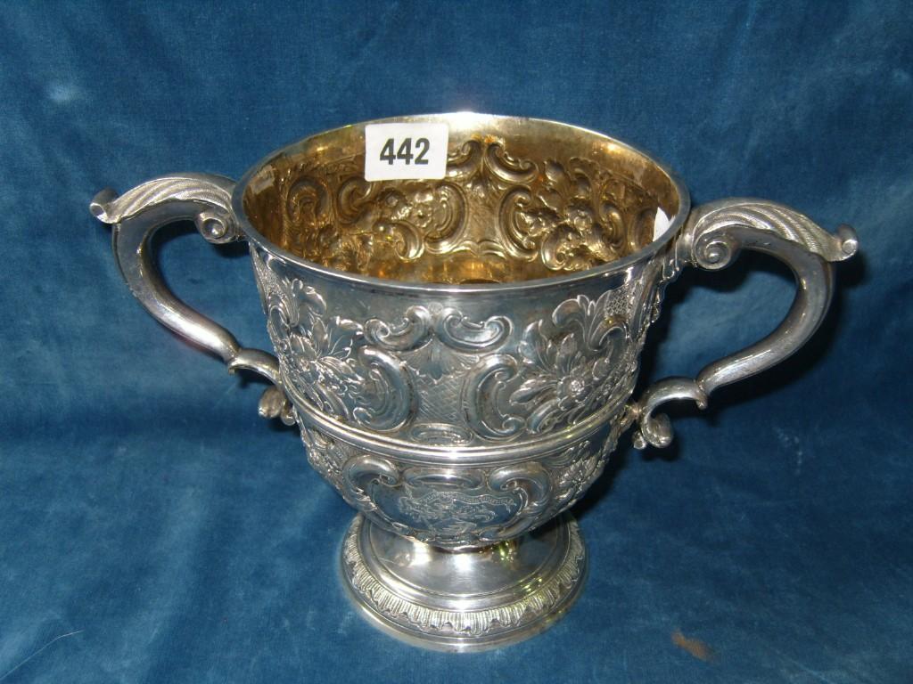 Appraisal: An Irish silver -handled cup of cylindrical form raised on