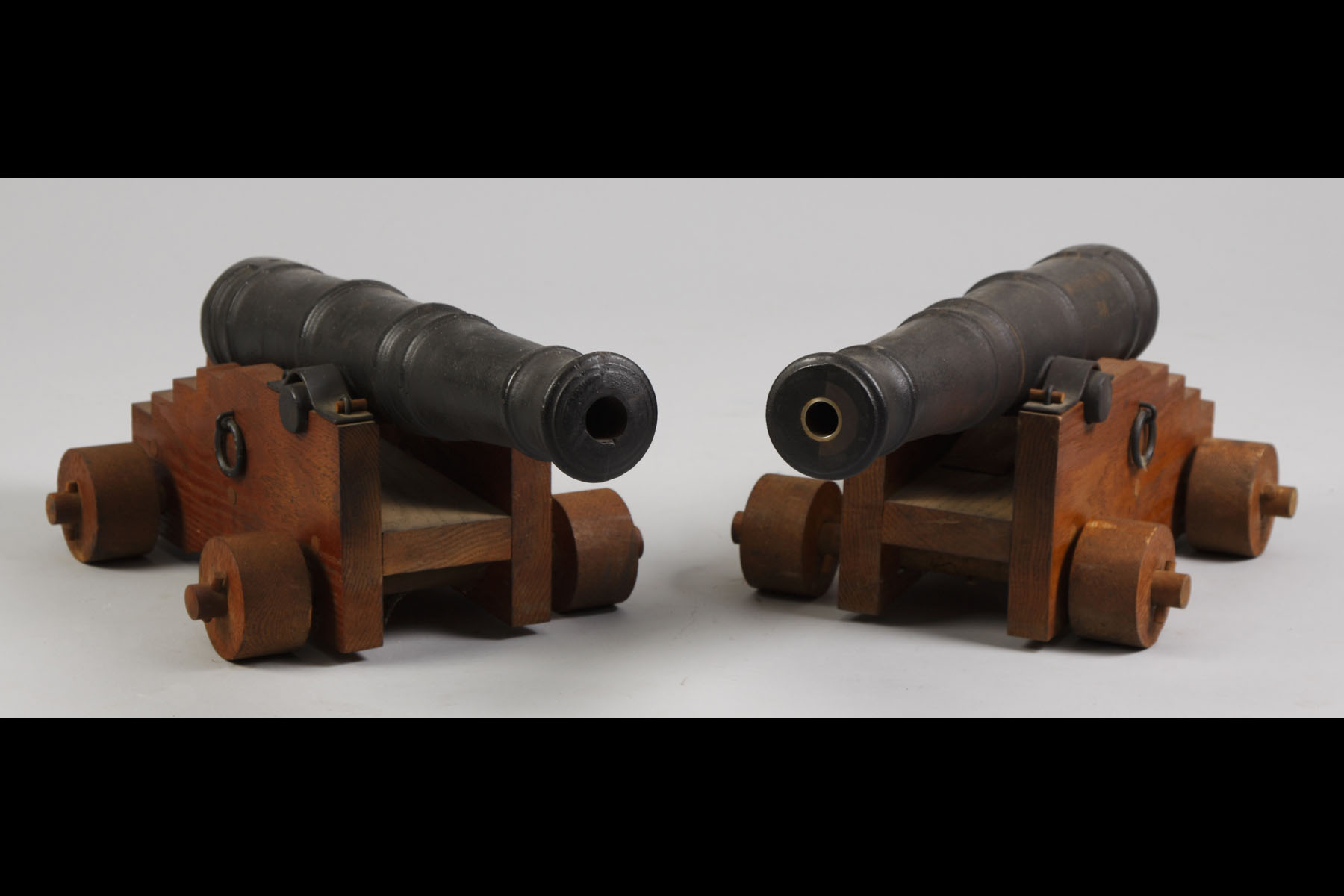 Appraisal: Small Cast Iron Cannons on Wood Frames The Gun Exchange