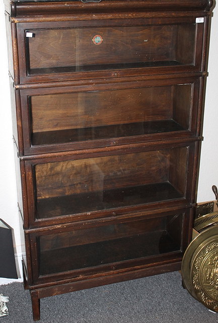 Appraisal: A GLOBE WERNICKE FOUR TIER GLAZED FRONT BOOKCASE cm wide