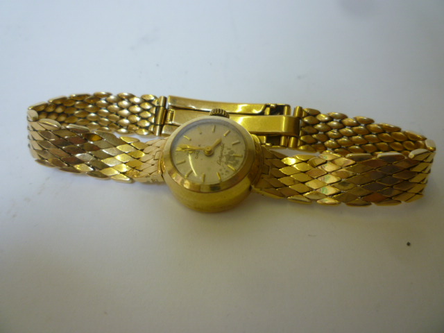 Appraisal: A LADY'S CT GOLD OMEGA WRISTWATCH the champagne dial inscribed