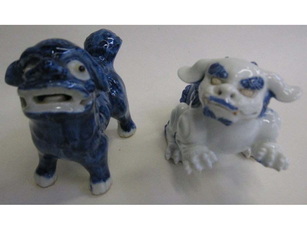 Appraisal: Two porcelain fo dogs